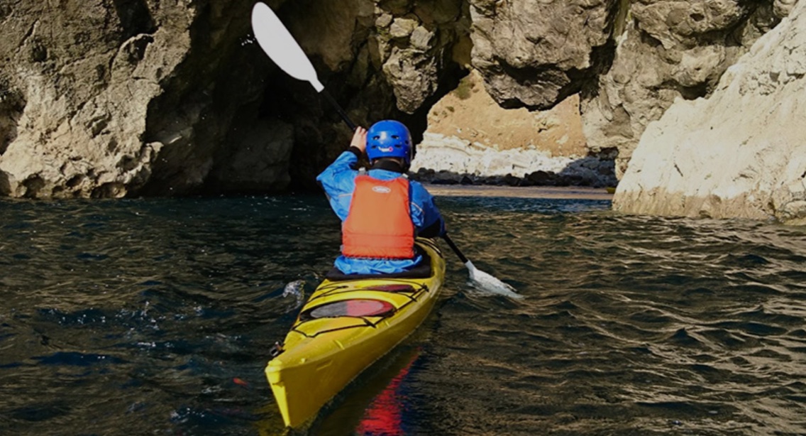 Sea kayaking along the coast